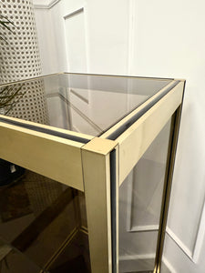 Console dorée et verre fumé