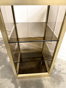Console dorée et verre fumé