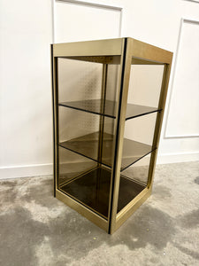 Console dorée et verre fumé