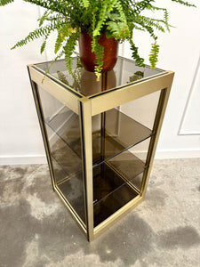Console dorée et verre fumé