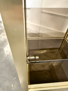 Console dorée et verre fumé