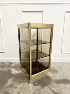 Console dorée et verre fumé